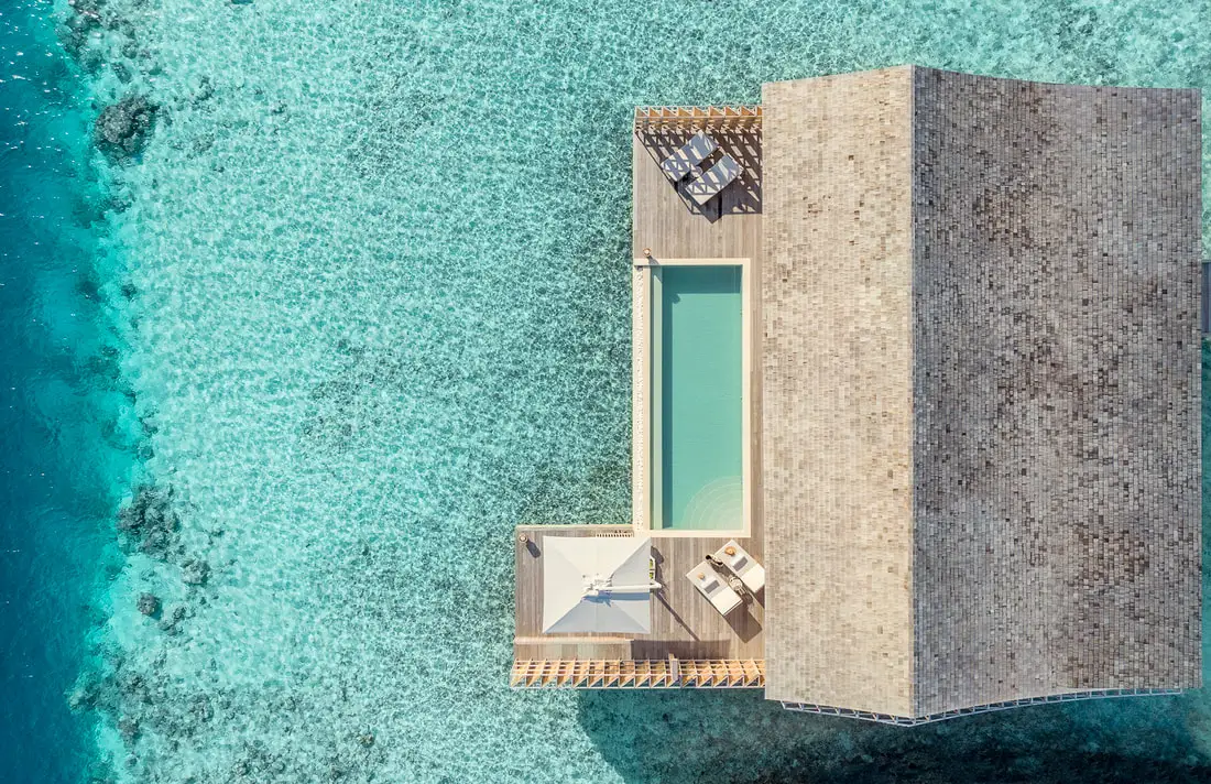 The wooden structure of the island retreat, including each residence, is built with eco-conscious materials