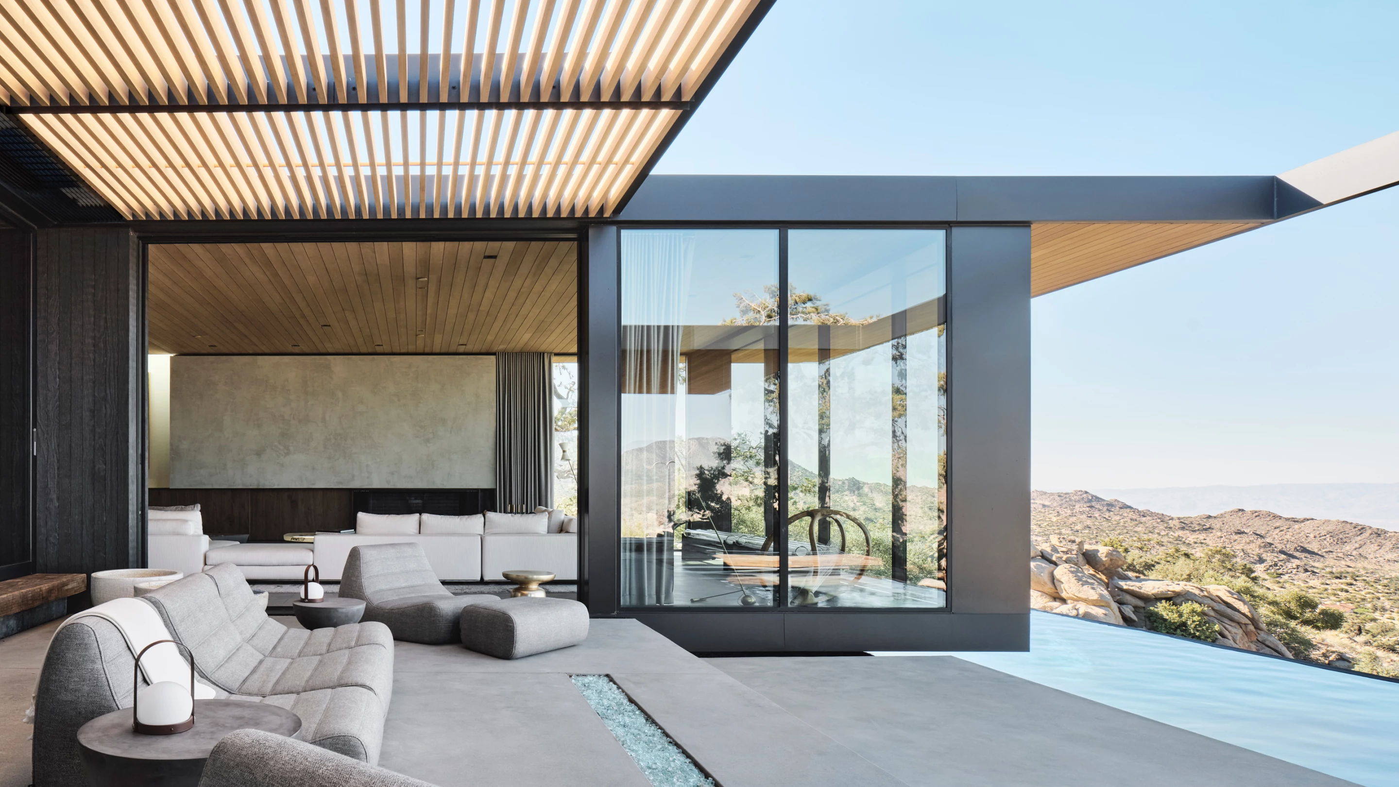 High Desert Retreat offers views of the beautiful landscape with generous glazing which opens in places to promote natural cooling