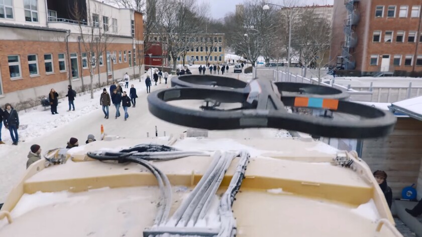 A drone is launched from the roof of the refuse truck to scan the surrounding area and locate bins