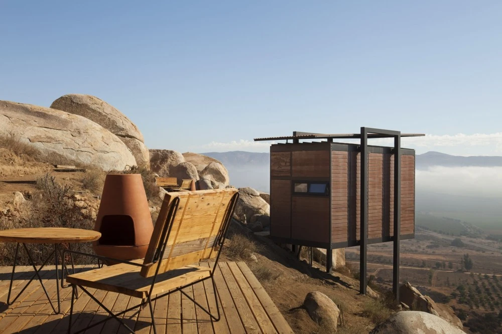 The 20-square-meter cabins are mounted on steel stilts, and their small size is overtaken by the vast panoramic vistas of the dramatic surrounding landscape