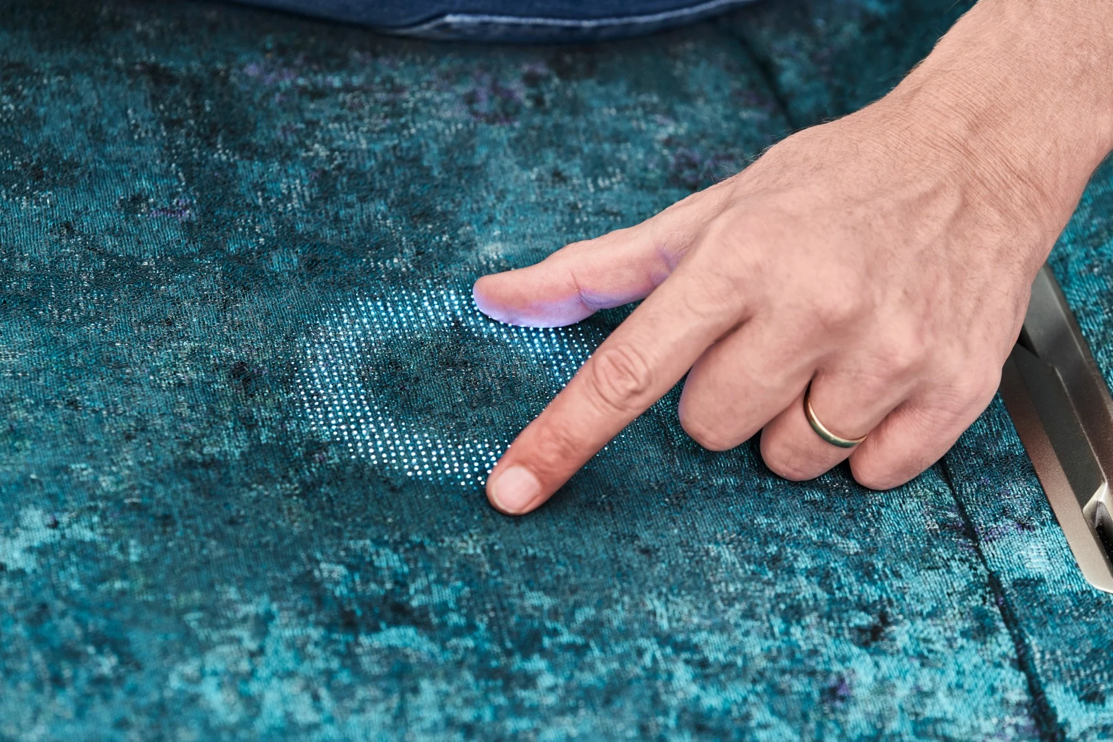 Some control surfaces within the BMW Vision iNext are hidden beneath cloth or wood coverings