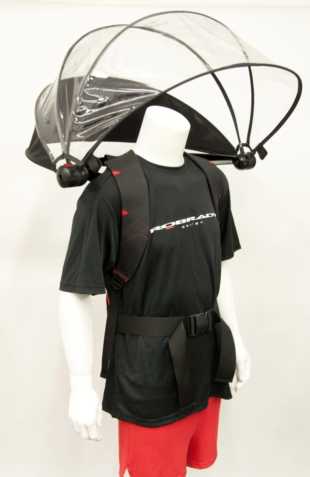 The redesigned Nubrella extends coverage farther forward, providing a roof over tablets, smartphones, food, etc.