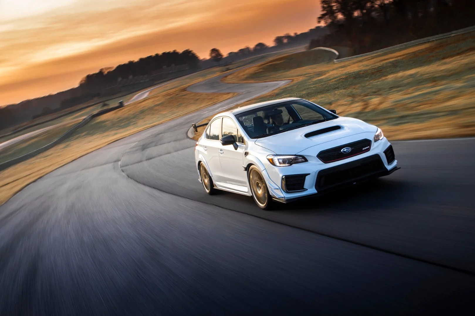 The S209 carries a wide-body exterior treatment, making it 1.7 inches (4.3 cm) wider than a production WRX STI