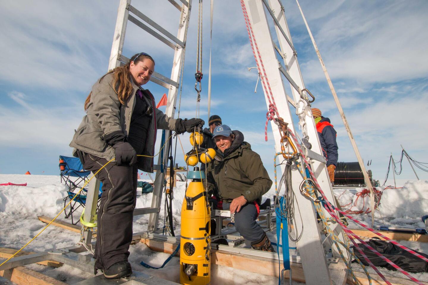 ITGC researchers Britney Schmidt (left) and Andy Mullen retrieve the robotic submarine Icefin after its last dive to the seafloor foundations of Thwaites Glacier