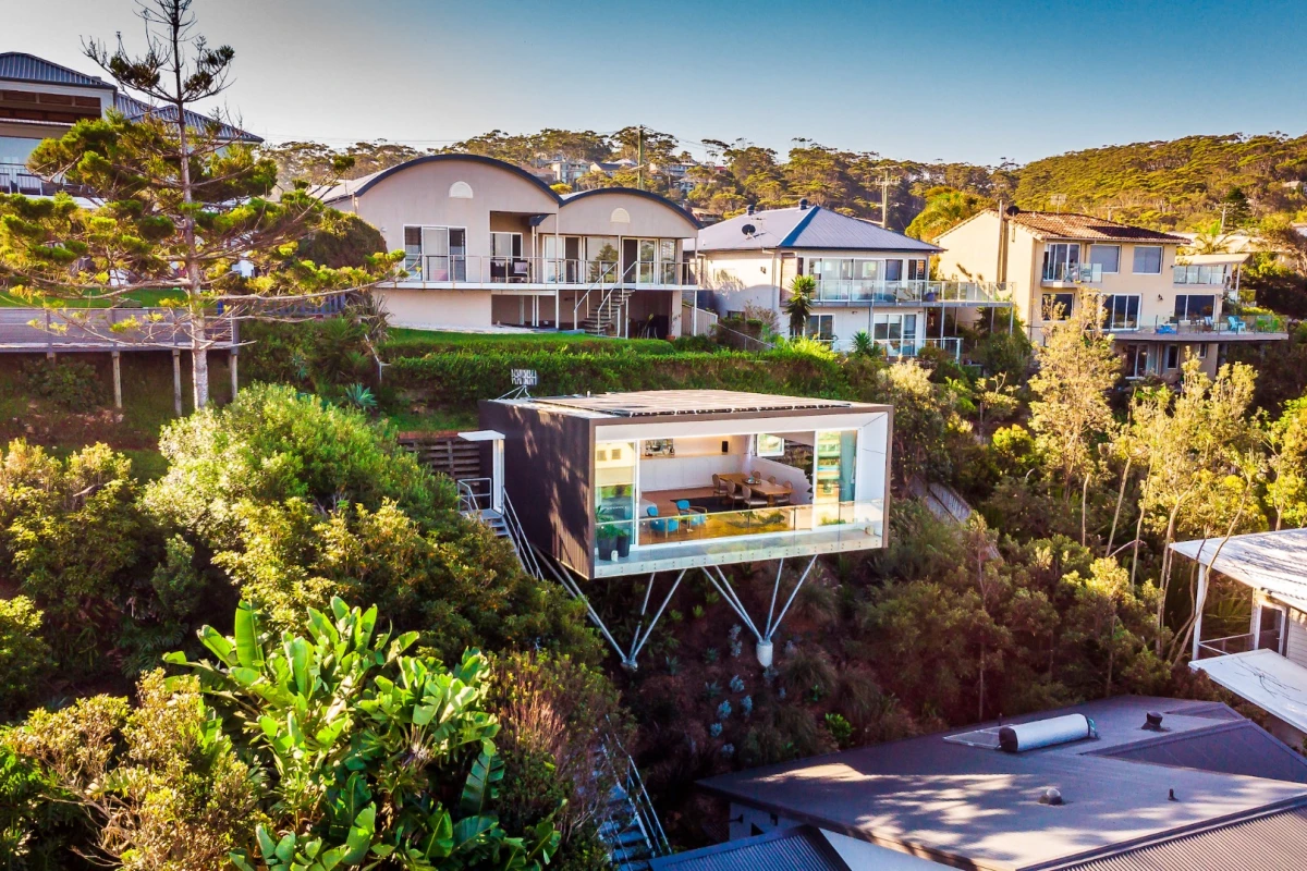 North Avoca Studio is raised on steel stilts and cantilevers impressively over a steep slope