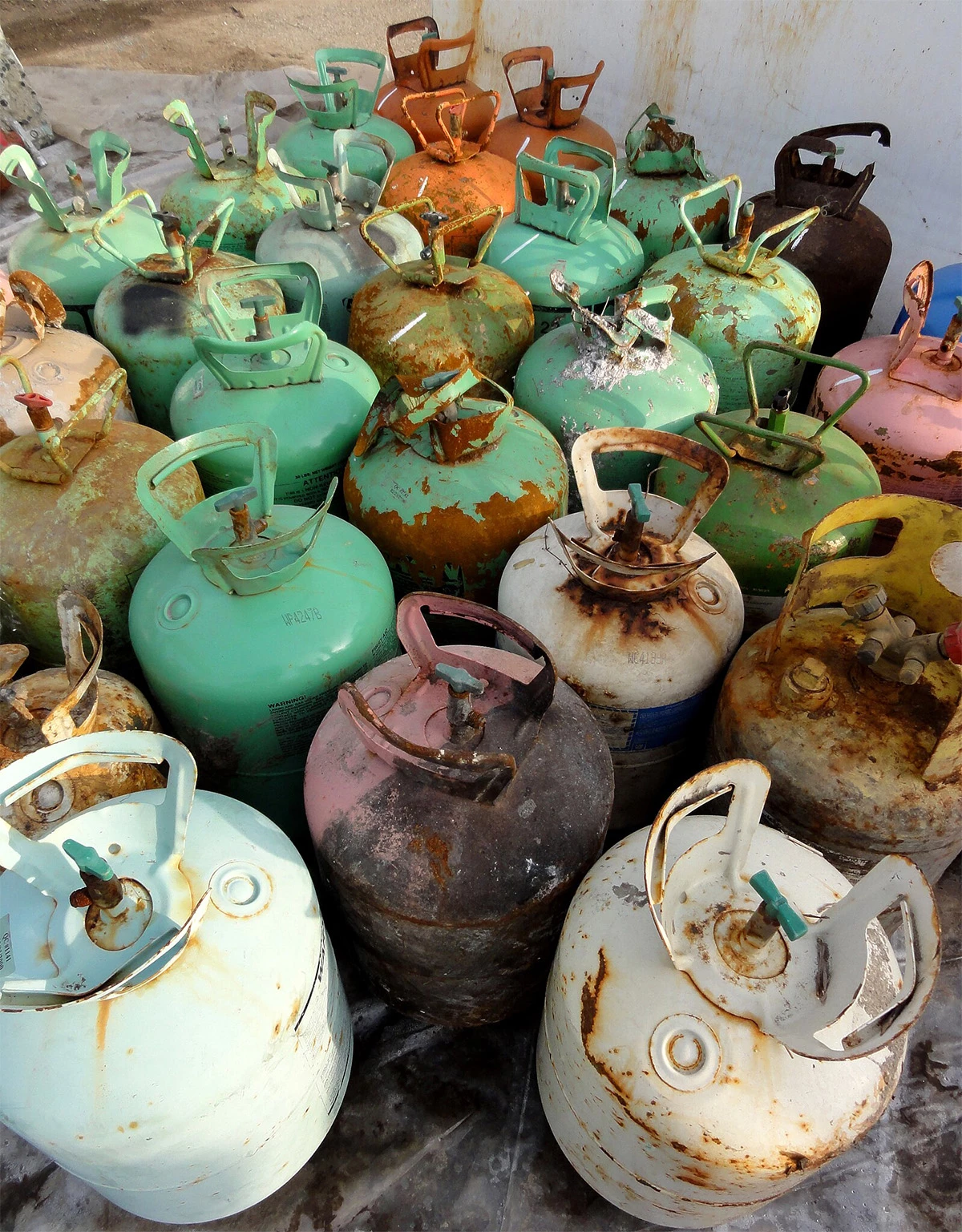 Refrigerants like R22 Freon – usually sold in tanks like these – that cause a greenhouse effect have been banned in countries committed to the Montreal Protocol