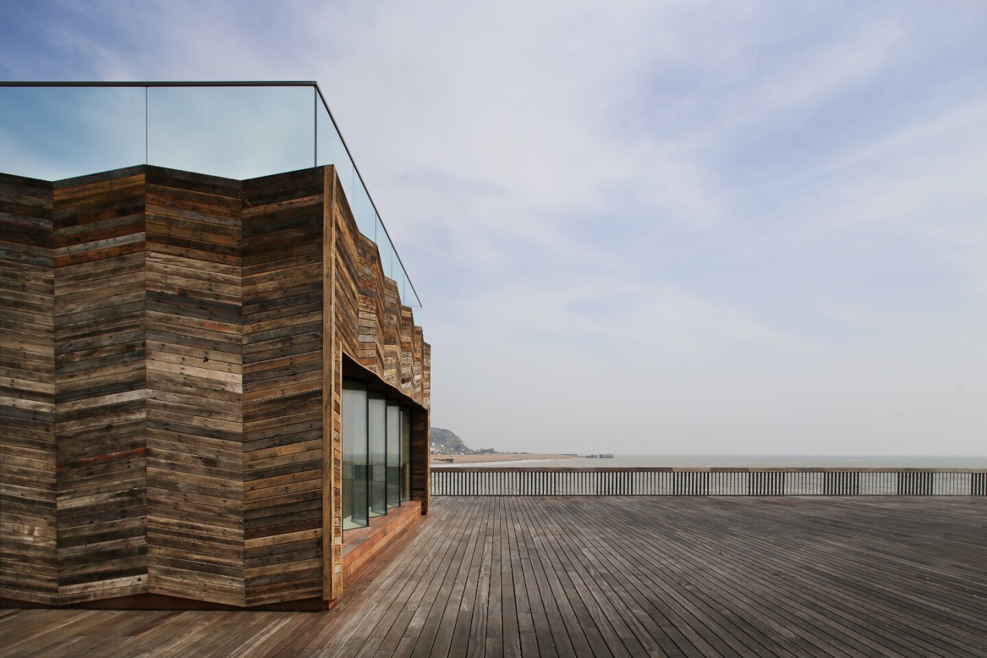 Hastings Pier's visitor's center is made from reclaimed wood scorched by the previous fire