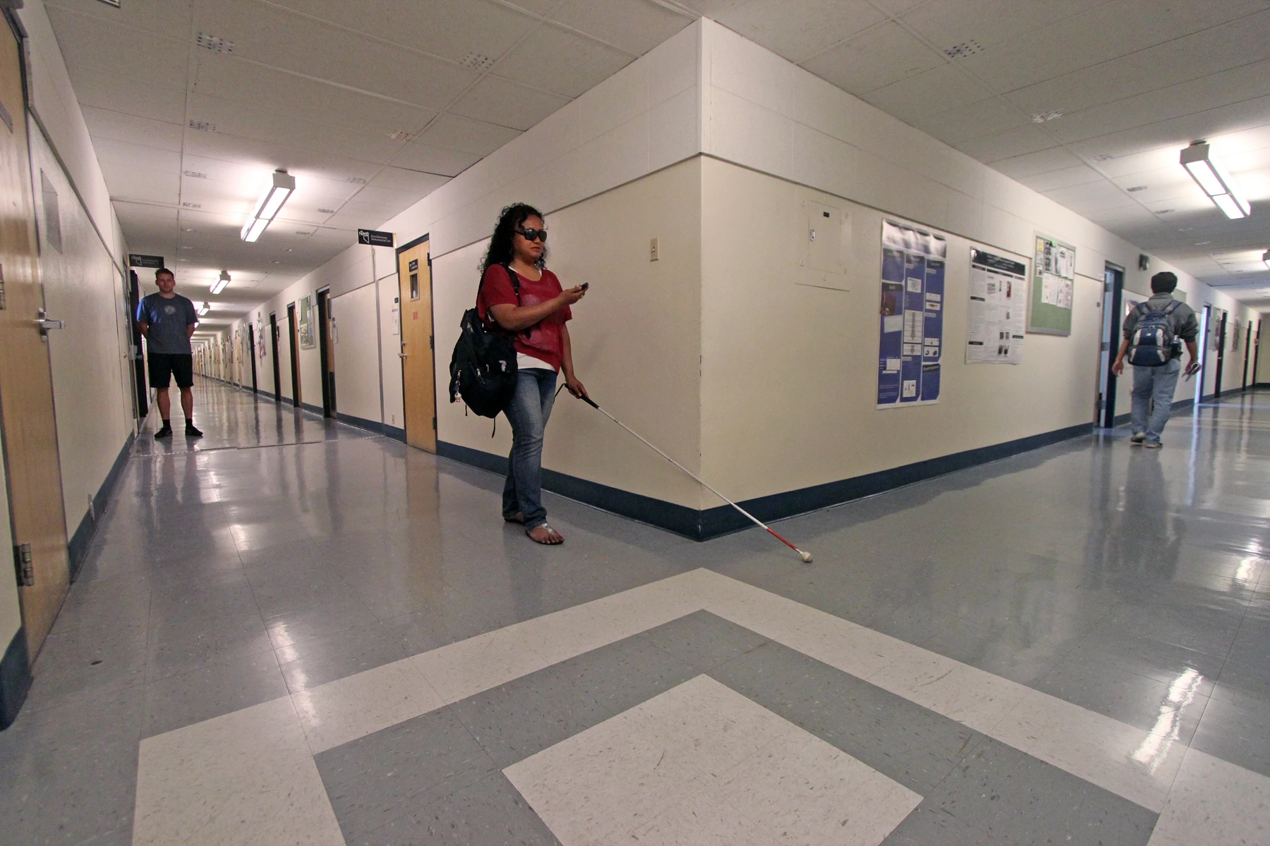 Eelke Folmer watches as student Dora Uchel demonstrates the Navatar system