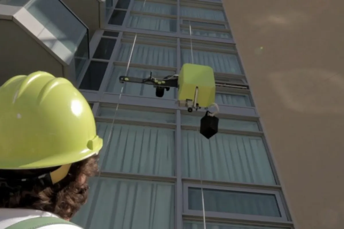 SAM ascends a building