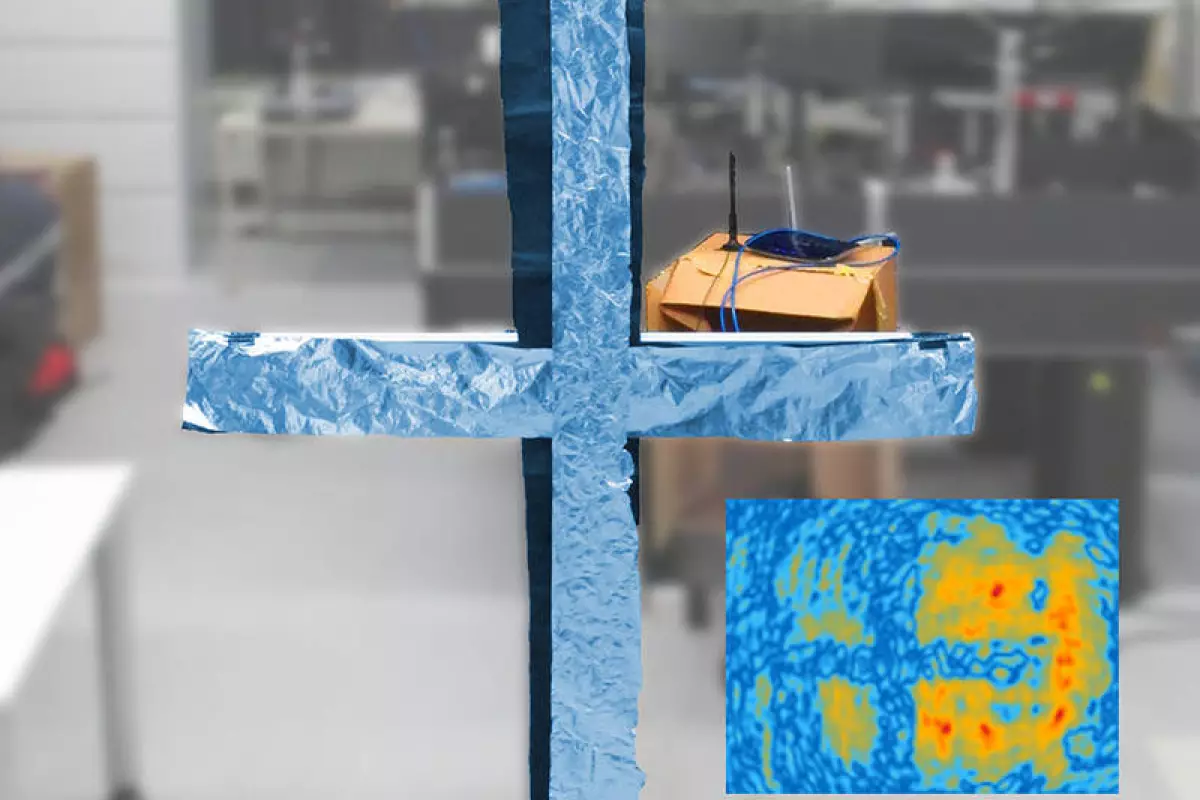 A cross made of aluminum foil between the viewer and the Wi-FI router can easily be reconstructed from the Wi-Fi hologram as can be seen in the inserted picture