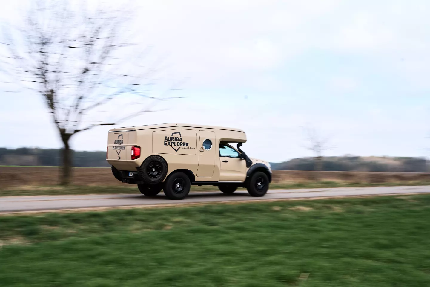 The Auriga Explorer shows off its full-size spare tires, wedge-back rear and sprinting chops