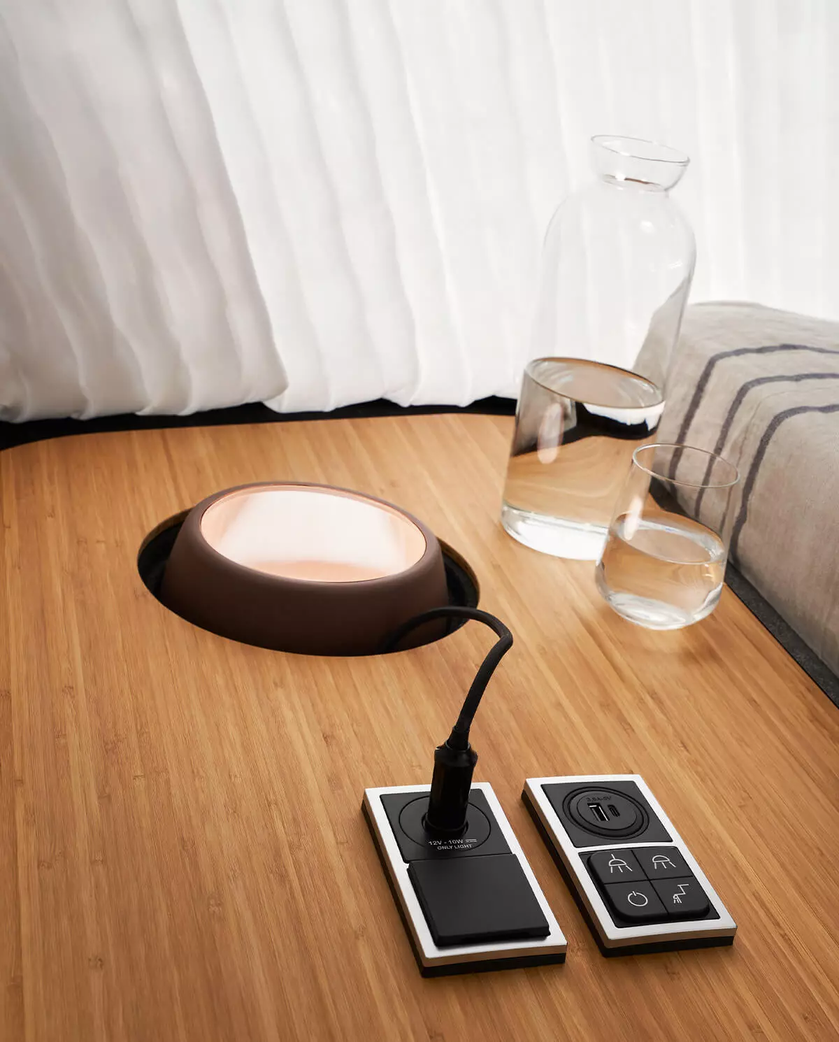 Unlike the mattress-only pop-up sleeper areas of other camper vans, the Hymer Venture S has a nightstand with electrical outlets