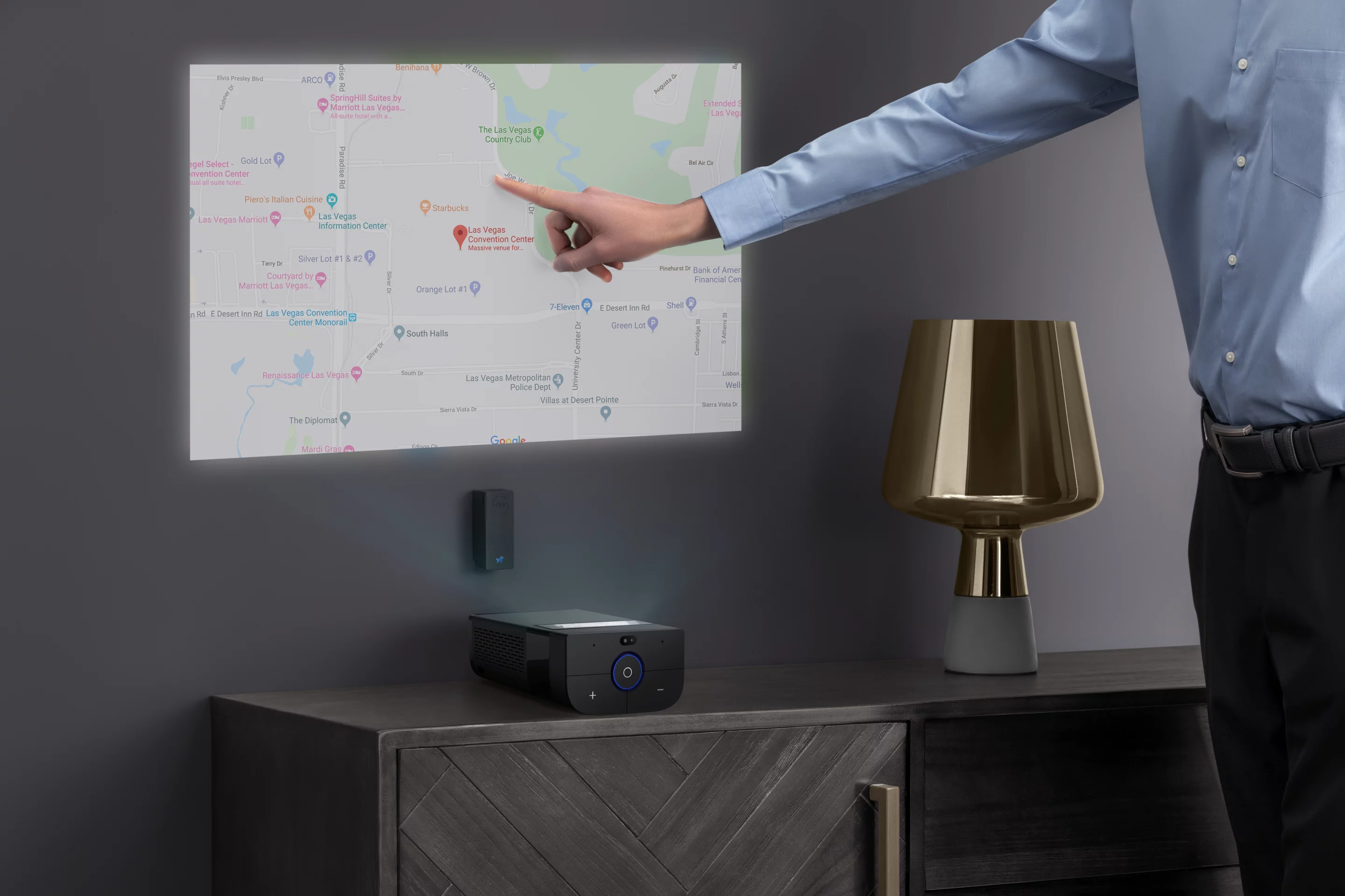 The touch display technology will work when the image is thrown up on a wall, but the unit will need to be placed up close