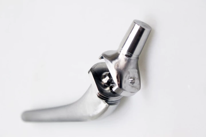 The artificial hip's ball and socket components are connected by a sliding screw, which can be adjusted to change the implant's length