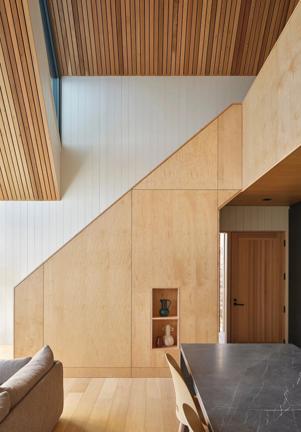 Maple plywood clads the internal partitions and staircase
