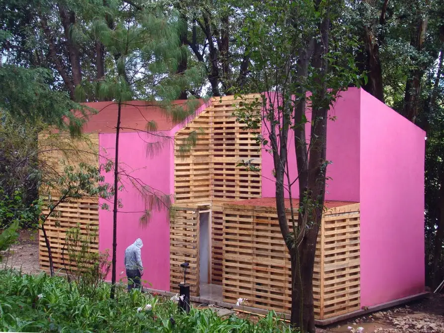 This low-cost home by Mexican architect Tatiana Bilbao costs just US$8,000 to build, and comprises a central core built from concrete blocks, with surrounding modules constructed from wooden pallets
