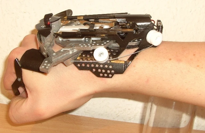Hobbyist Patrick Priebe's latest creation is a wrist-mounted laser-sighted mini crossbow