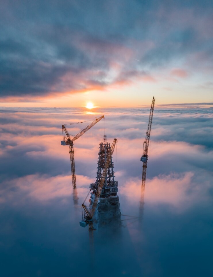 Sun rises over a skyscraper under construction in Saint Petersburg, Russia
