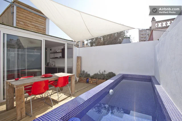 Container House features a modern outdoor deck with swimming pool and barbecue area