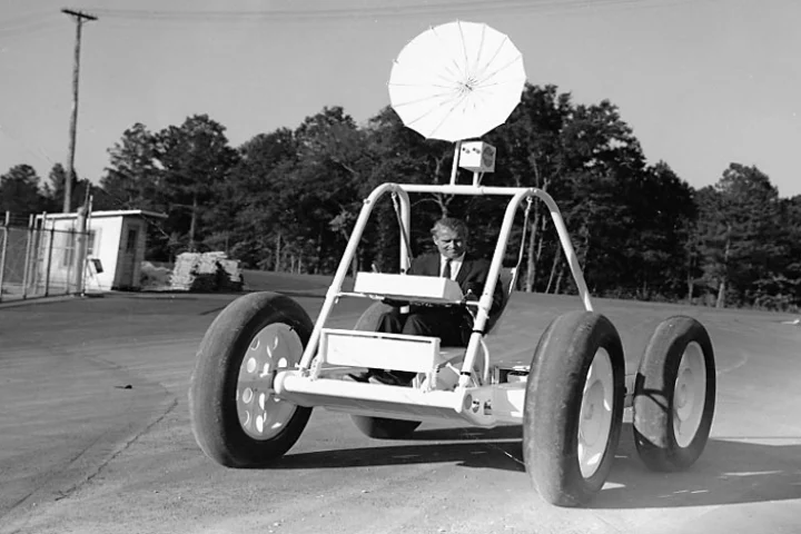 The prototype moon buggy is shown here being piloted by Wehrner von Braun, the vehicle is considered an important part of space history