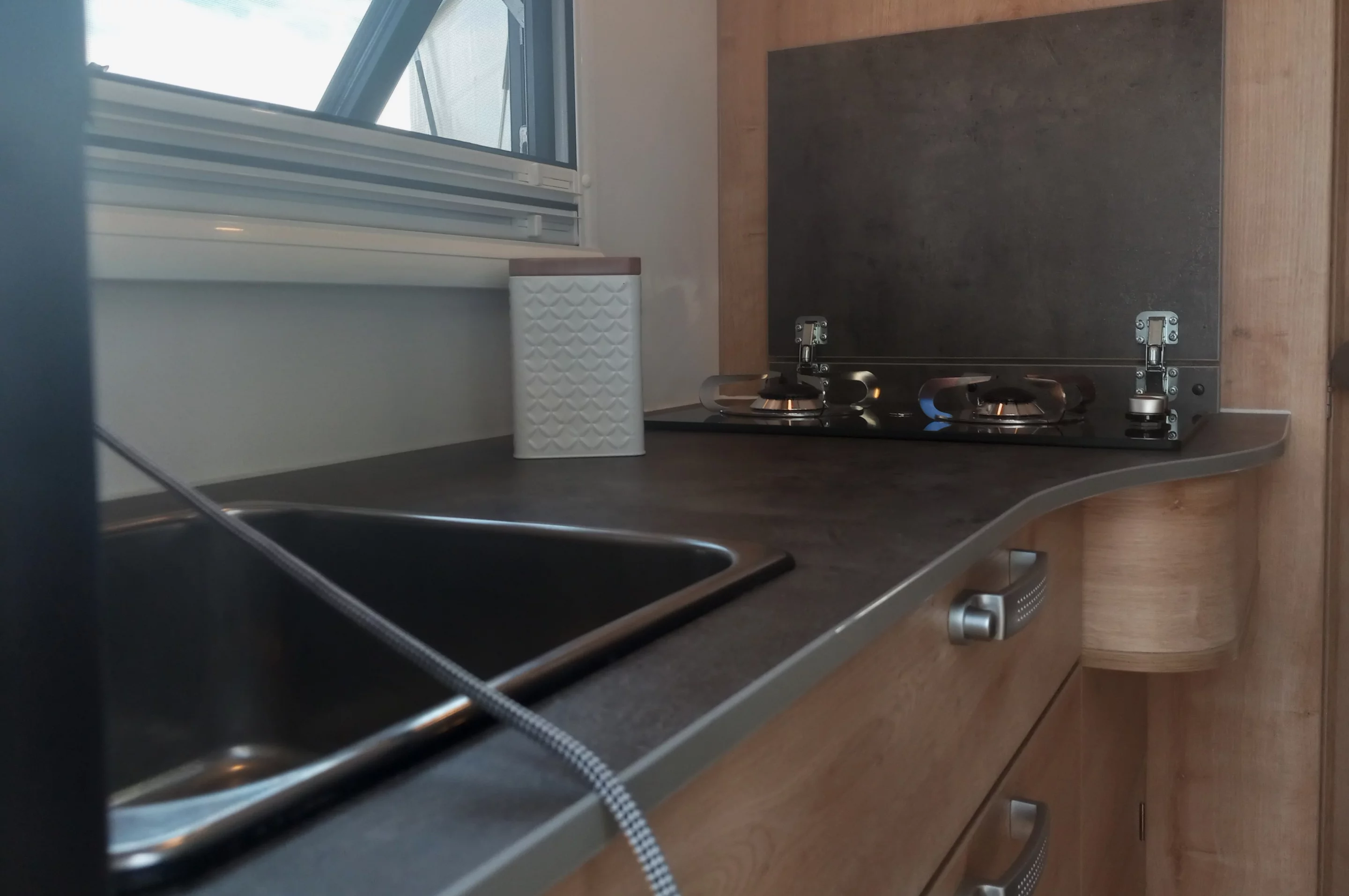 A look at the kitchen and dual-burner LPG stove; World Travel Vehicles also offers an induction cooktop with its upgraded electrical system