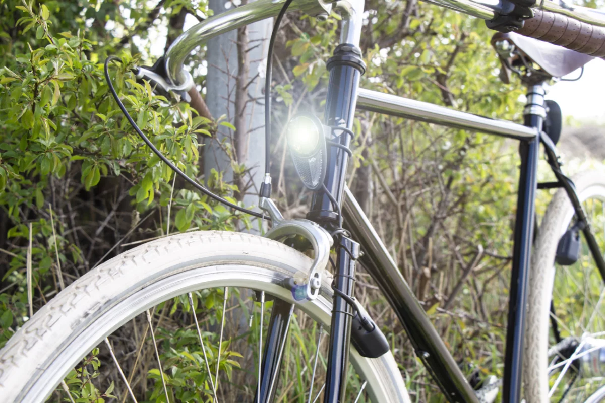 The Reelight Nova headlight, with the no-contact dynamo visible beside the wheel rim