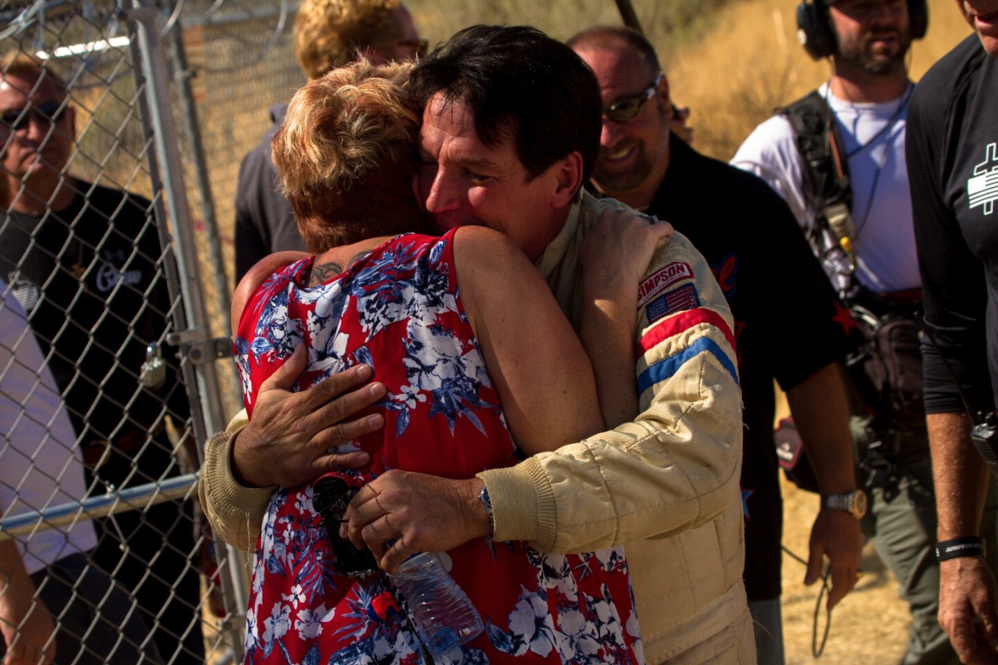 Final hugs for friends and family members before the jump