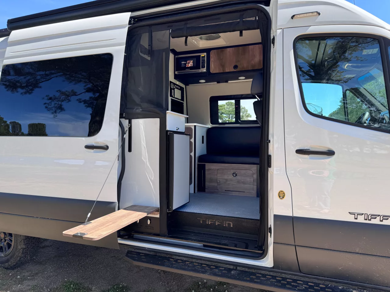 Like the original GH1 and many other adventure camper vans, the GH2 includes a fold-down outdoor worktop