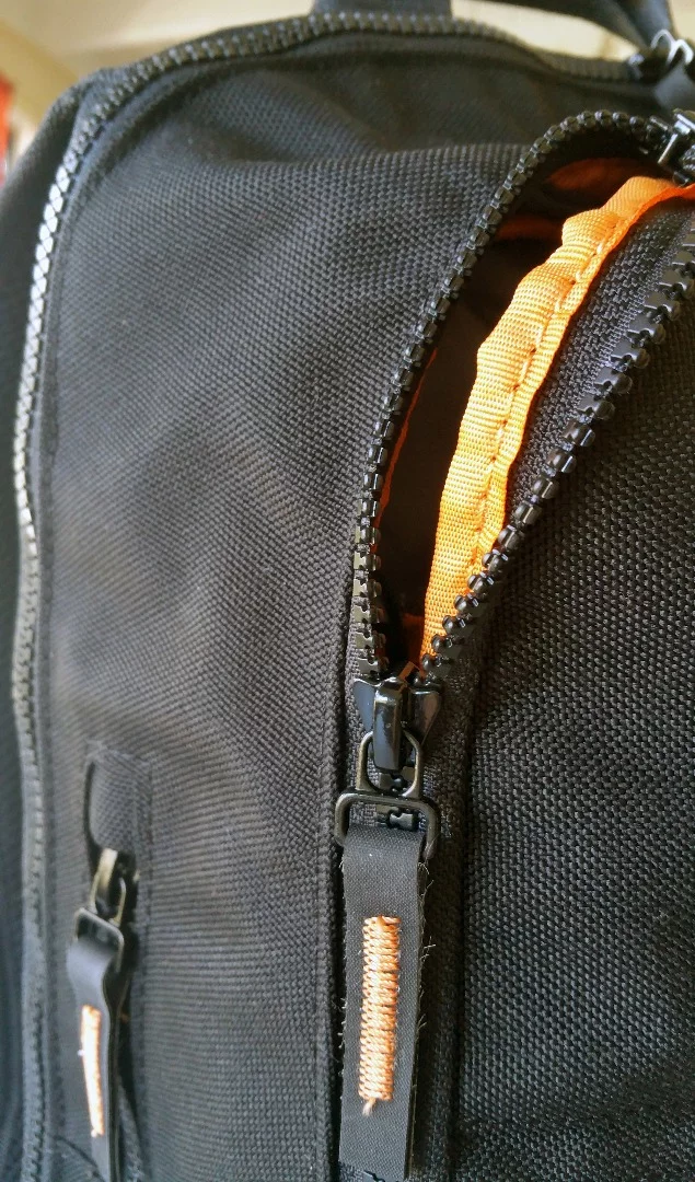 The MOS Pack uses YKK zippers throughout, each with strong, long pulls
