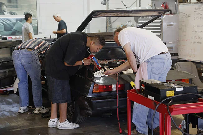 The team puts the finishing touches to the now-electric Lotus Esprit