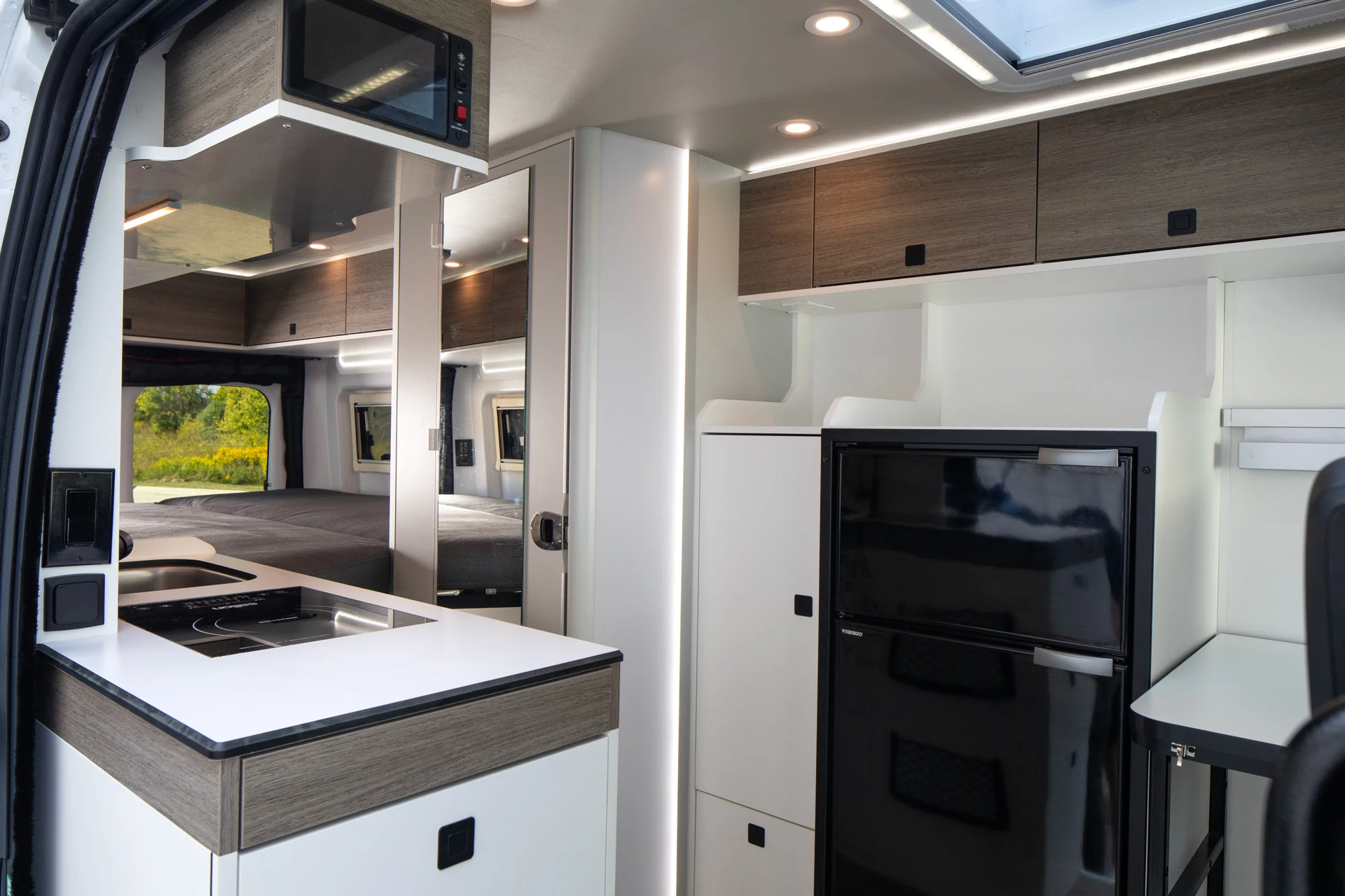 The big change between SRT and Wave For 2 happens near the front, with a fridge console replacing the rear dinette bench to create a roomy two-person layout