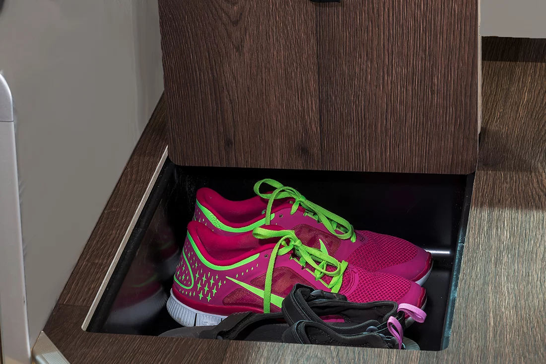 Under-floor storage below the table