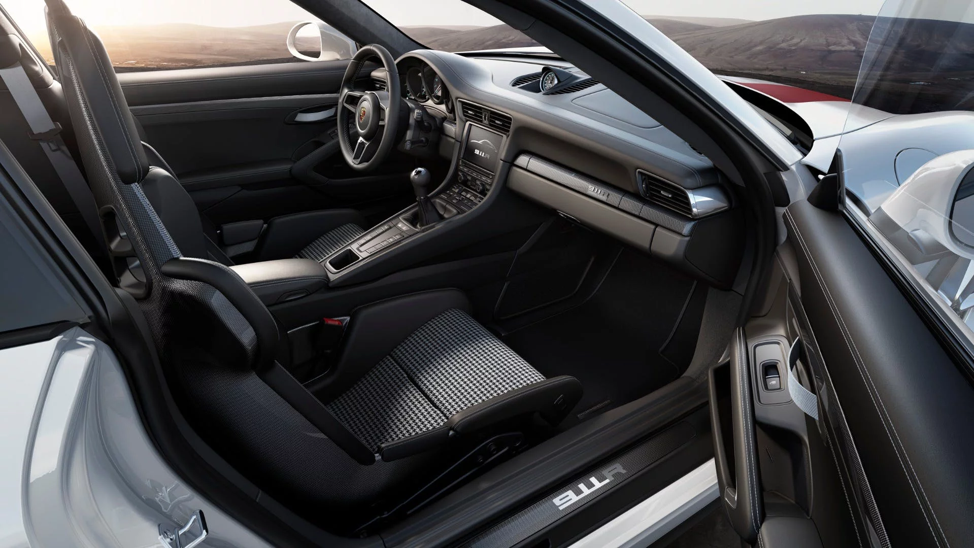 The 911 R cabin has houndstooth seats and a simple layout