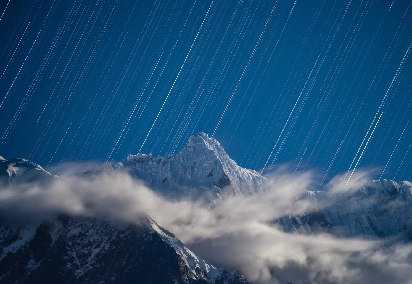 Winner - Skyscapes. Stabbing into the Stars. Nyingchi, Tibet, China.Sony ILCE-7R3 camera, Tamron 150–500mm lens, 150mm f/5.6, 75 x 30-second exposures
