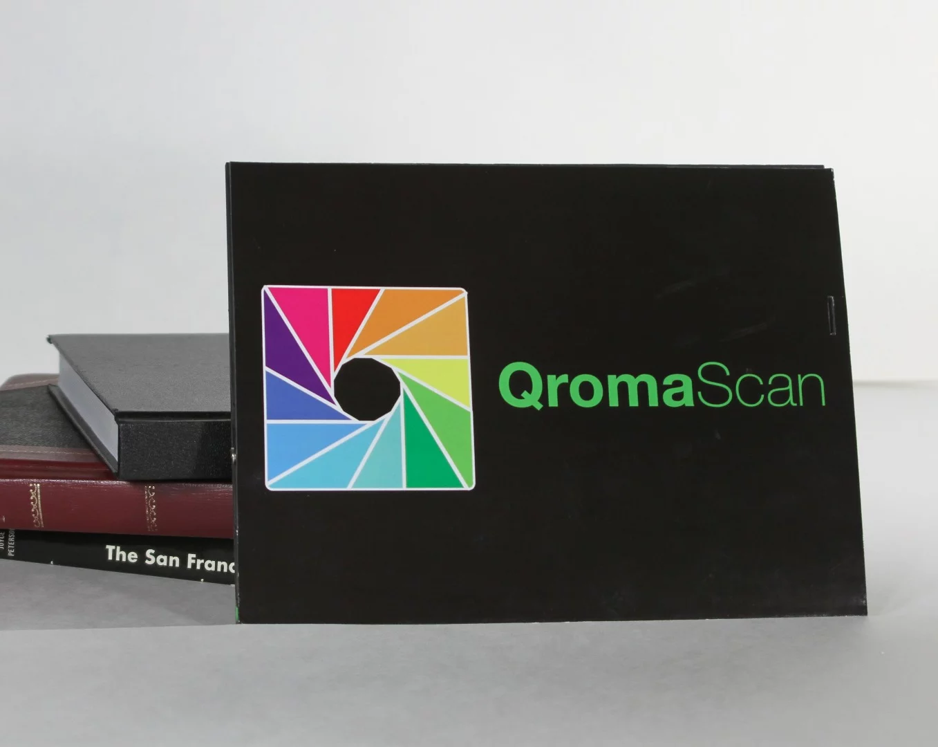 The QromaScan Lightbox folds down to the size of a book when not in use scanning photos