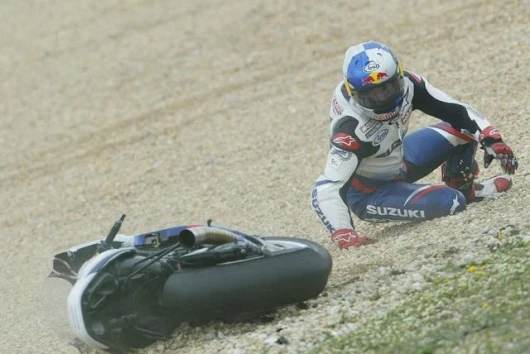 John Hopkins hope of a sixth place finish on the Suzuki is crushed as he slides off in the rain