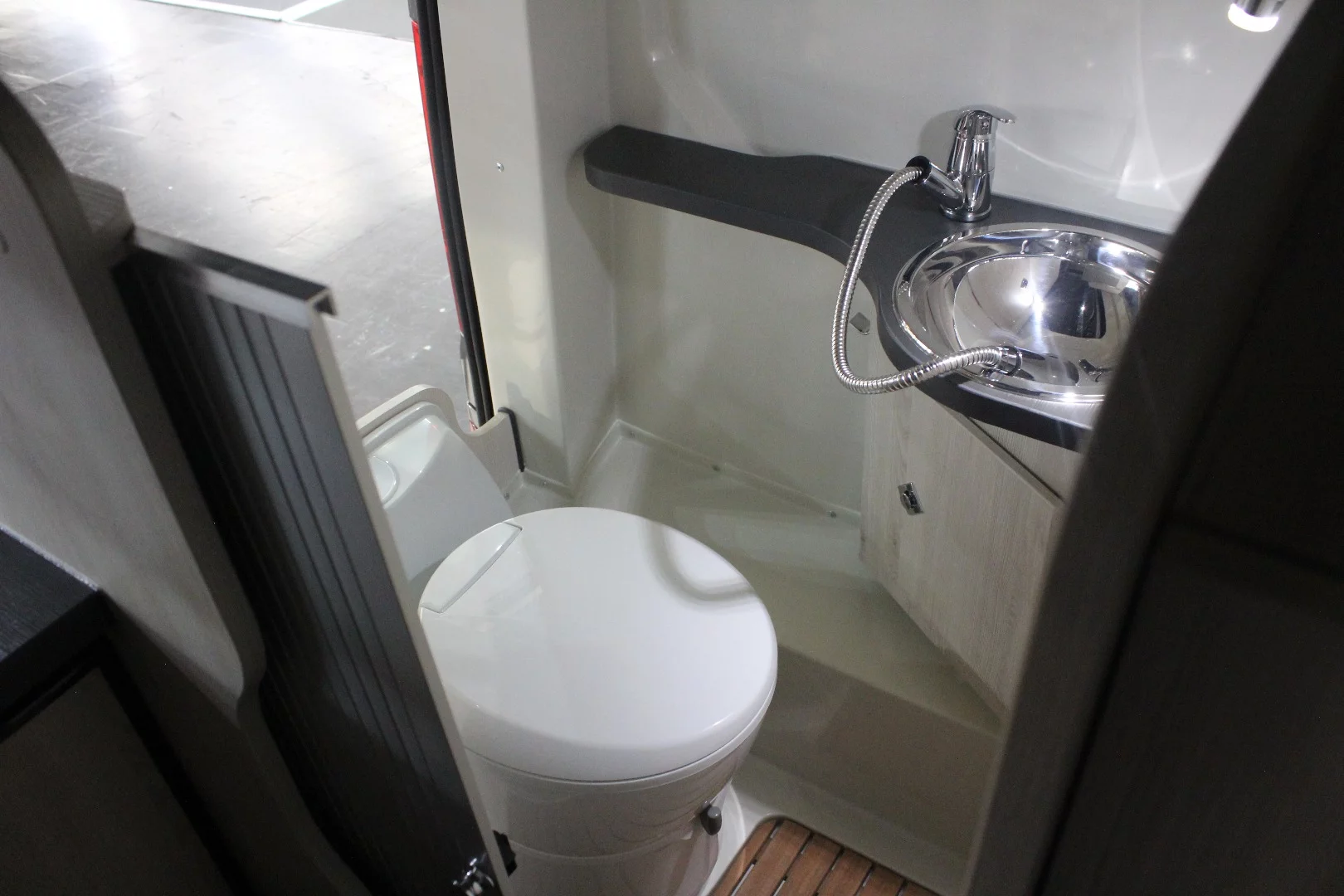 The Danny 530's toilet is a bit compact and less-than-private, but it's certainly more civil than digging a hole or using a portable toilet behind the bumper
