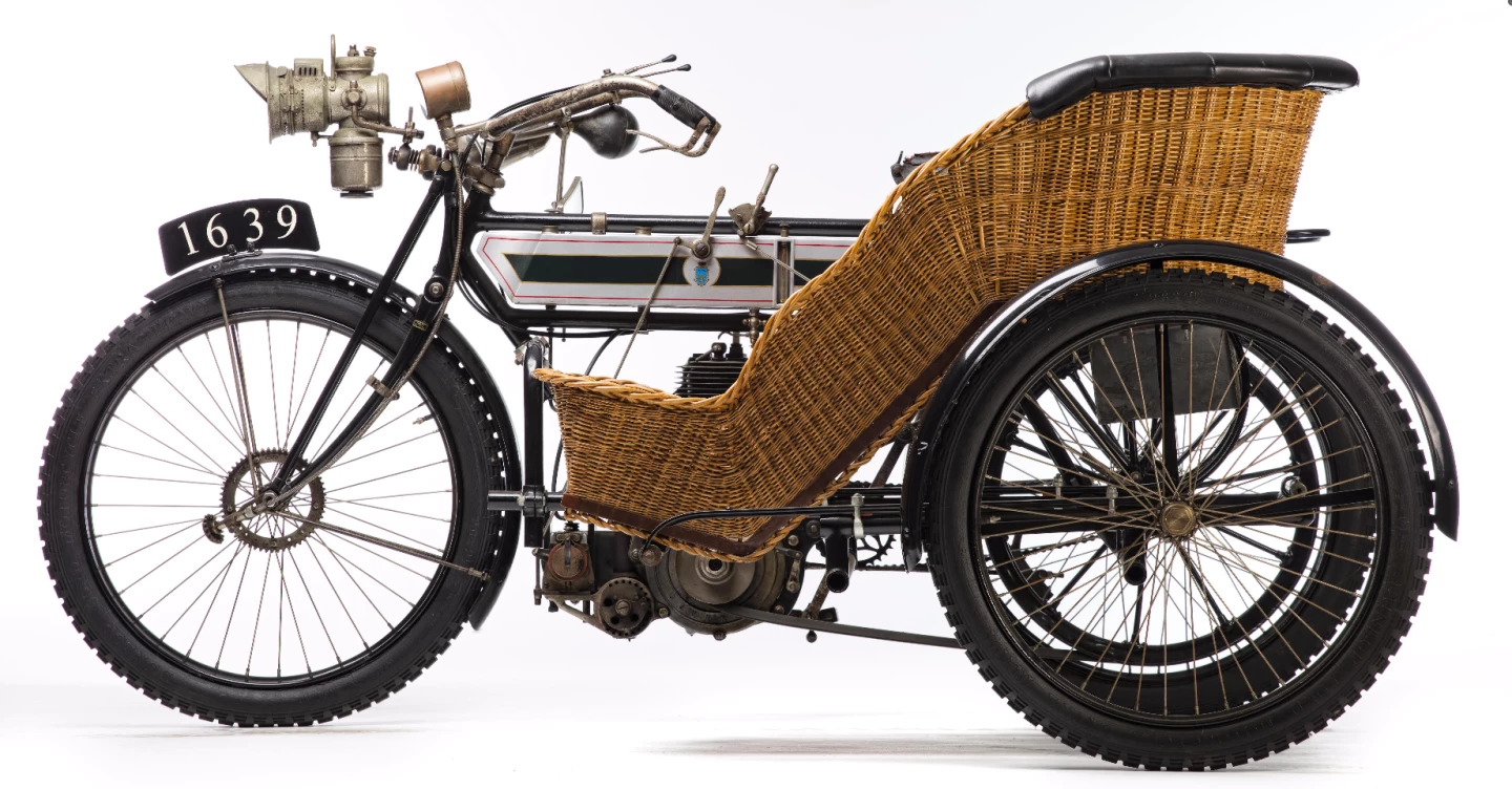 One of the great buys of the sale, and a perfect example of the lengths an enthusiast will go to in order to bring a bike back to life was this 1908 Triumph 3½hp sidecar combination which sold for £14,950 (US$ 18,181). It was first registered in 1908 in South Australia, dismantled for reconditioning prior to WWI and rediscovered in 1975 in a dismantled state with the parts spread around a large workshop. The vendor at this sale purchased the workshop's entire contents to ensure he got all needed parts for restoration. The bike was found to be complete except for the wicker sidecar body, so a replica of the latter was made to attach to the archeologically-manifested restoration. At 108 years of age and quite beautiful, it's a time warp and a magnificent restoration for the rather meagre price.