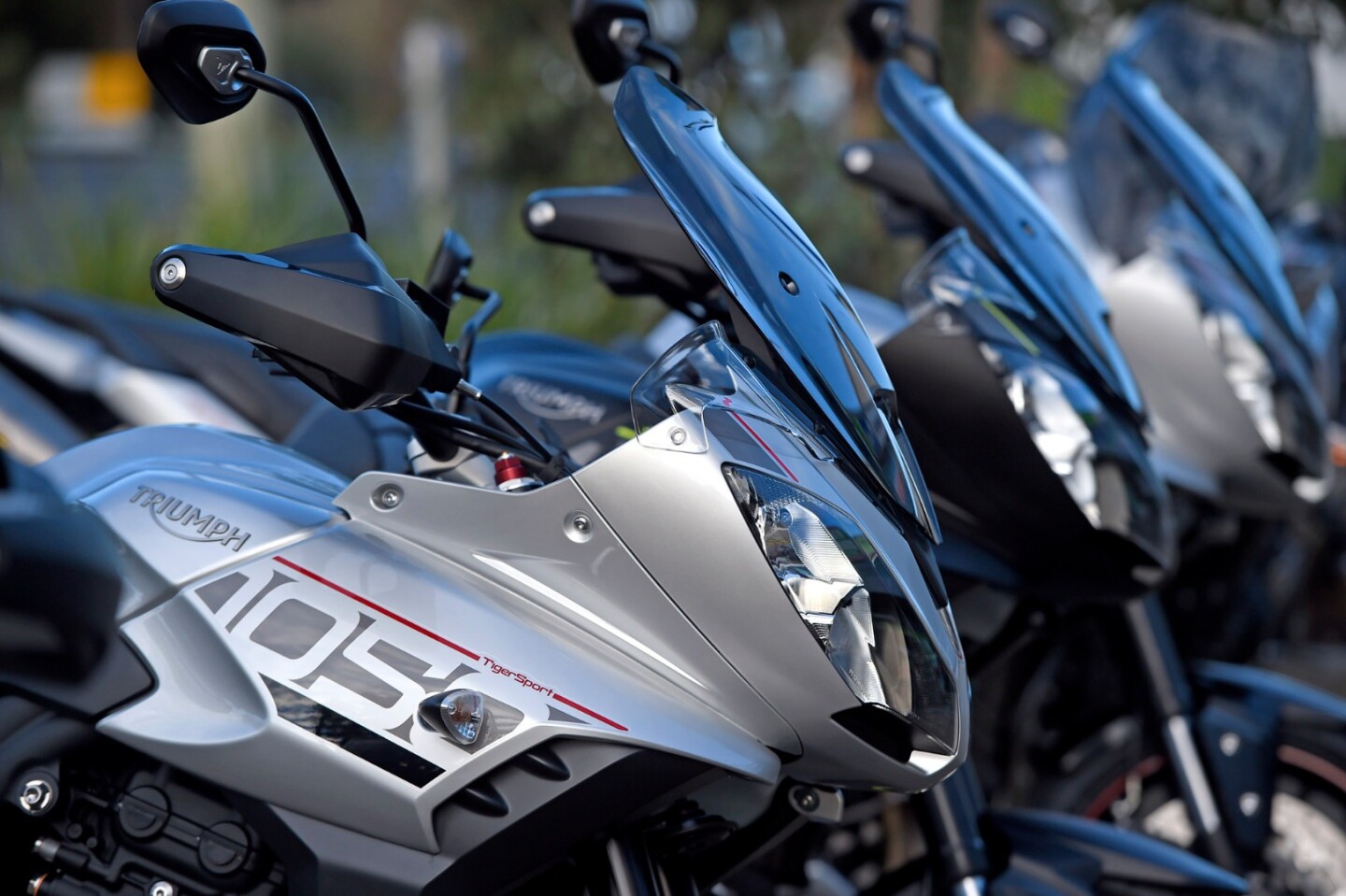 2016 Triumph Tiger Sport 1050: screen is hand adjustable on the move. It's a pretty inoffensive screen at legal speeds, but does create a lot of wind noise
