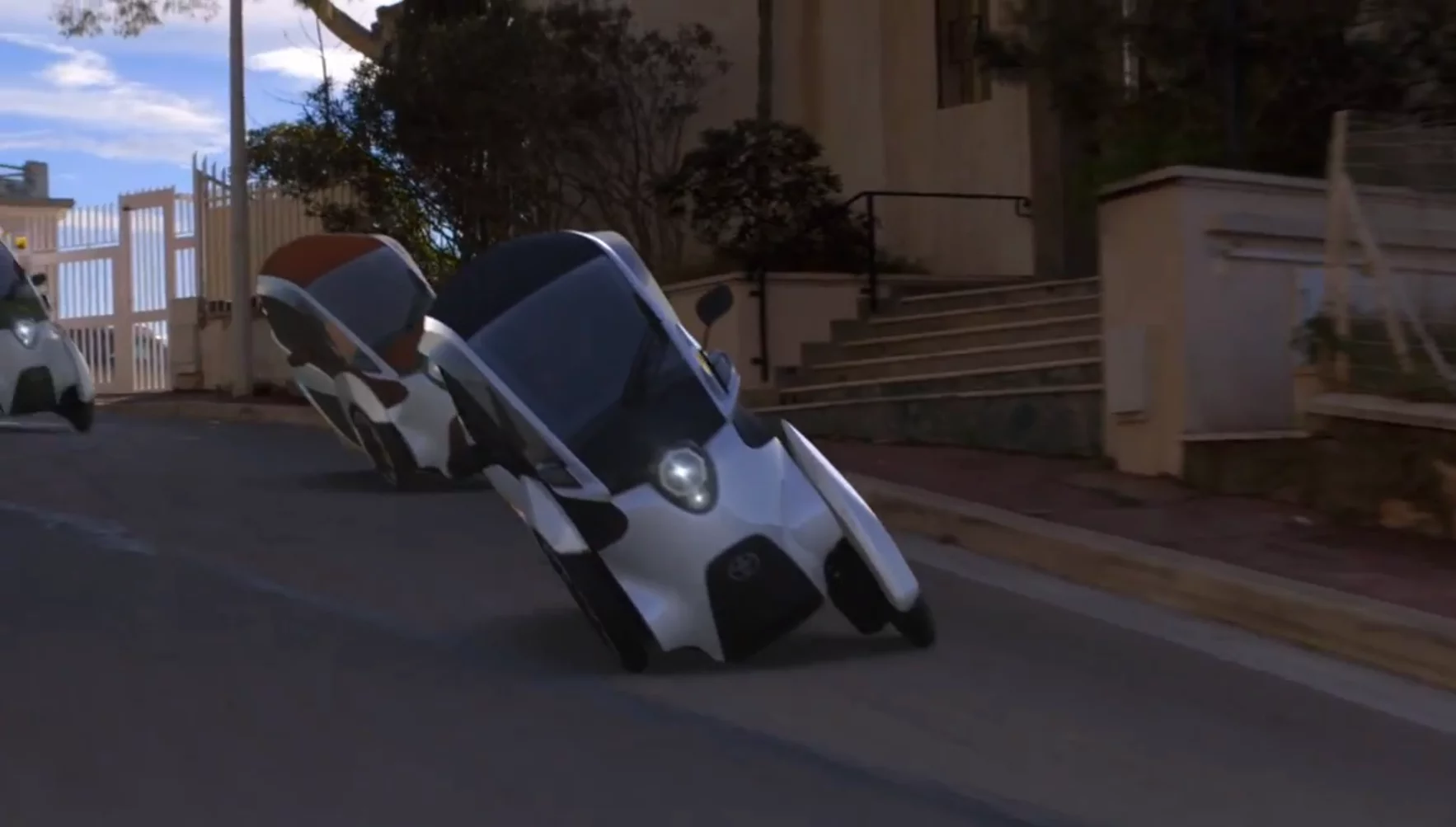 Toyota's i-ROAD is a fully-enclosed, two-seater, three-wheeled, fully-electric, Personal Mobility Vehicle (PMV)