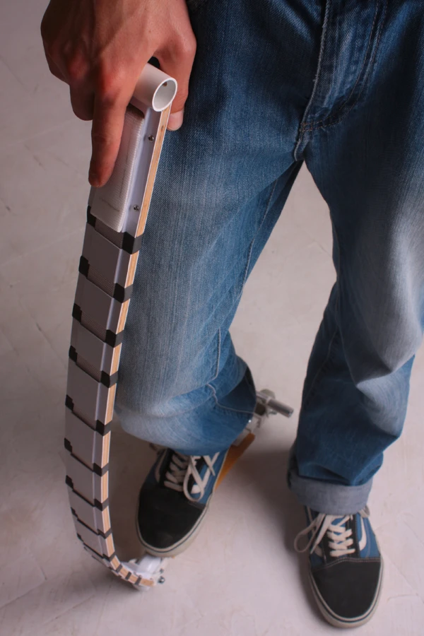 The vertical part of the Belt Scooter comprises a segmented design which stiffens when required