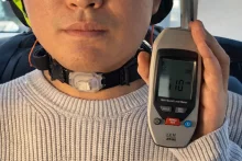 The neckband is made of soft silicone and combines a miniature camera and motion sensors with an AI model trained on the wearer's own voice