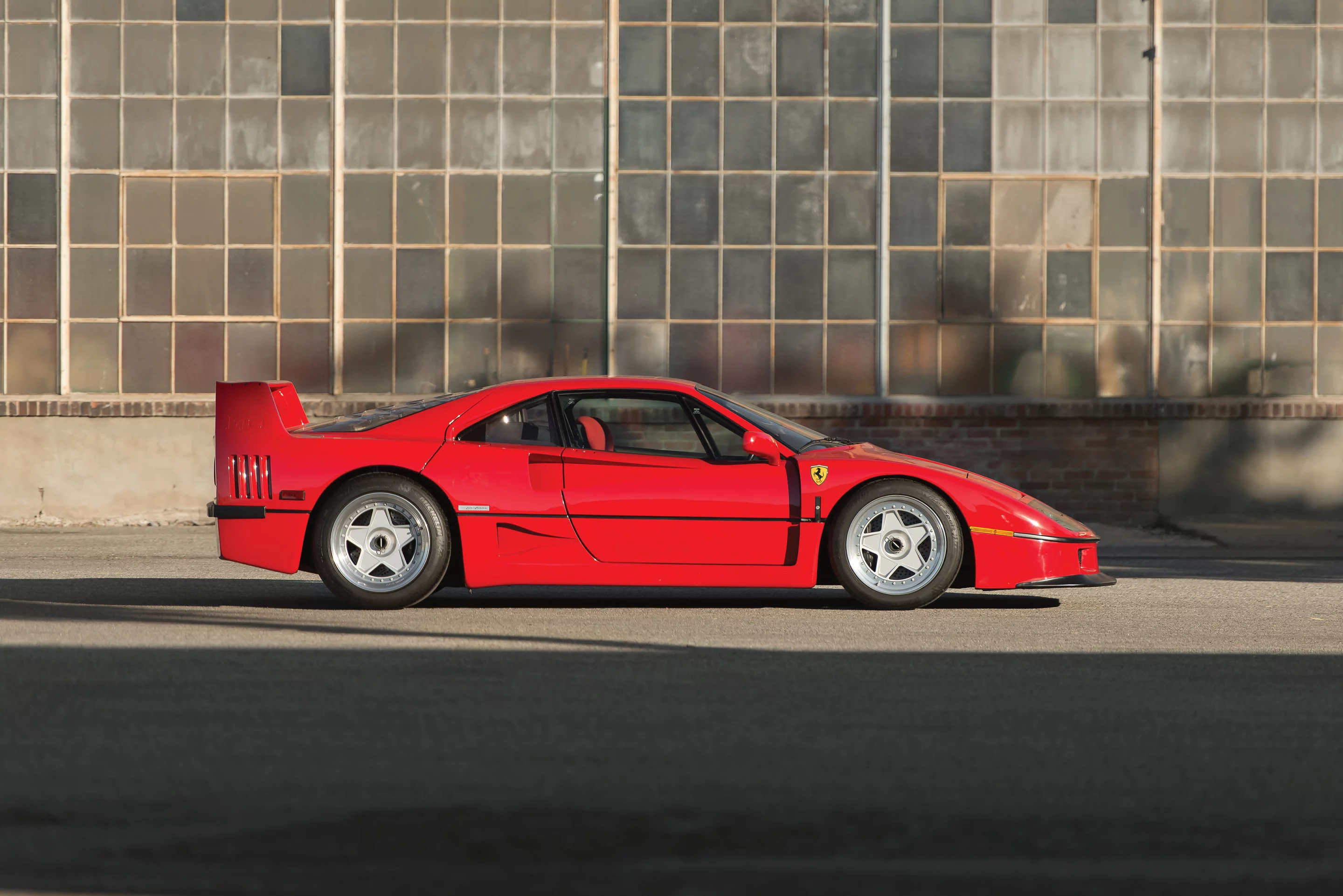 In 1986, Porsche claimed the title of the world's fastest road car when it introduced the 959 which could achieve 197 mph. Ferrari's answer was this car, the F40, which was developed from the 288 GTO Evoluzione. Using advanced aerodynamics and a 478 bhp, 2,936 cc DOHC twin-turbocharged V-8 engine with Weber-Marelli fuel injection, the F40 was the first production car to break the 200 mph barrier, achieving a top speed of 201.4 mph. This particular example, highlighted by its low mileage, Classiche certification, and impeccable condition, was sold by RM Auctions for US$1,265,000. Photos: Robin Adams ©2015