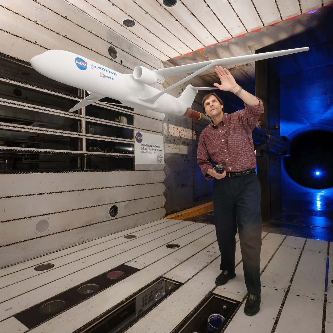 Greg Gatlin, NASA aerospace research engineer, inspects the truss-braced wing during testing in the Unitary Plan Wind Tunnel complex at NASA’s Ames Research Center in Silicon Valley