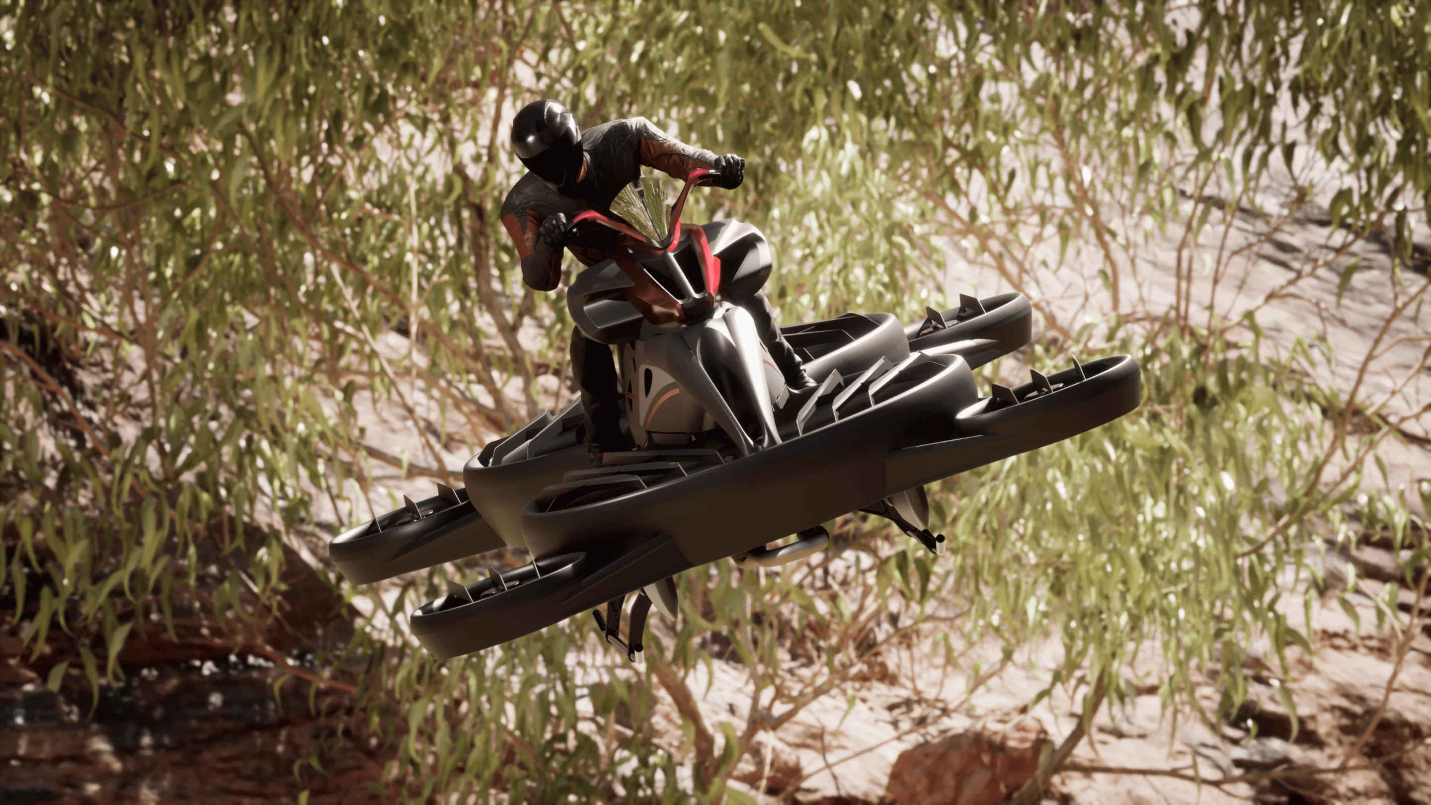 The rider straddles a motorcycle-like frame and sits atop caged props while flying short hops at up to 100 km/h