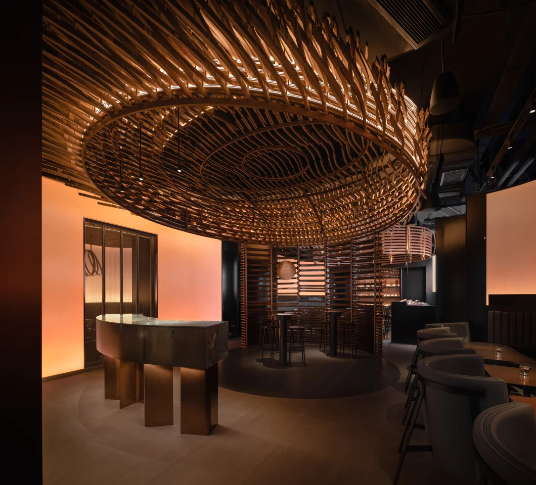 The Laizhou Bar's interior is topped by an eye-catching ceiling sculpture that's made using 3,000 pieces of wood taken from the whiskey barrels
