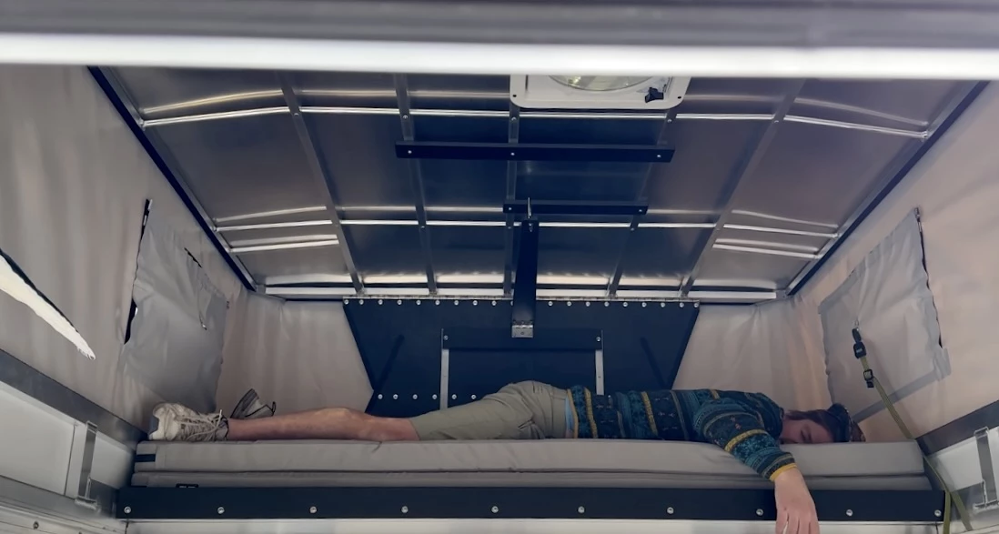 The 75-in interior width creates a bed that's wide enough for those 6-foot and under to lie across width wise rather than longitudinal, opening up more flexibility in sleeping three or four people (the sleeping platform is collapsed in the photo but extends at camp)