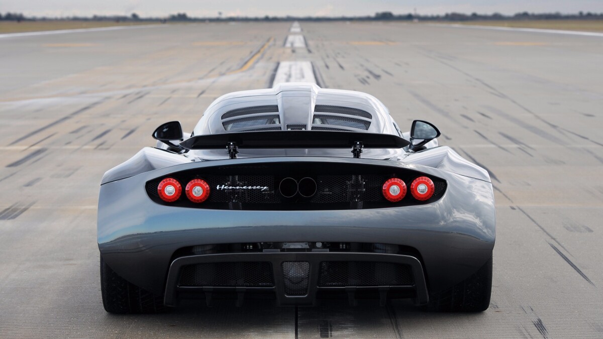 In April, 2013 the Hennessey Venom GT hit the headlines with a 265.7 mph (428 km/h) timed speed, bringing with it quite a controversy. The Hennessey Venom GT is manufactured by Texas-based Hennessey Performance Engineering, based on a heavily modified Lotus Exige chassis with massive American V8 muscle packed in.