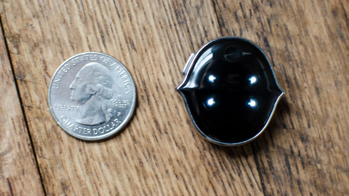 Senstone (quarter for size)