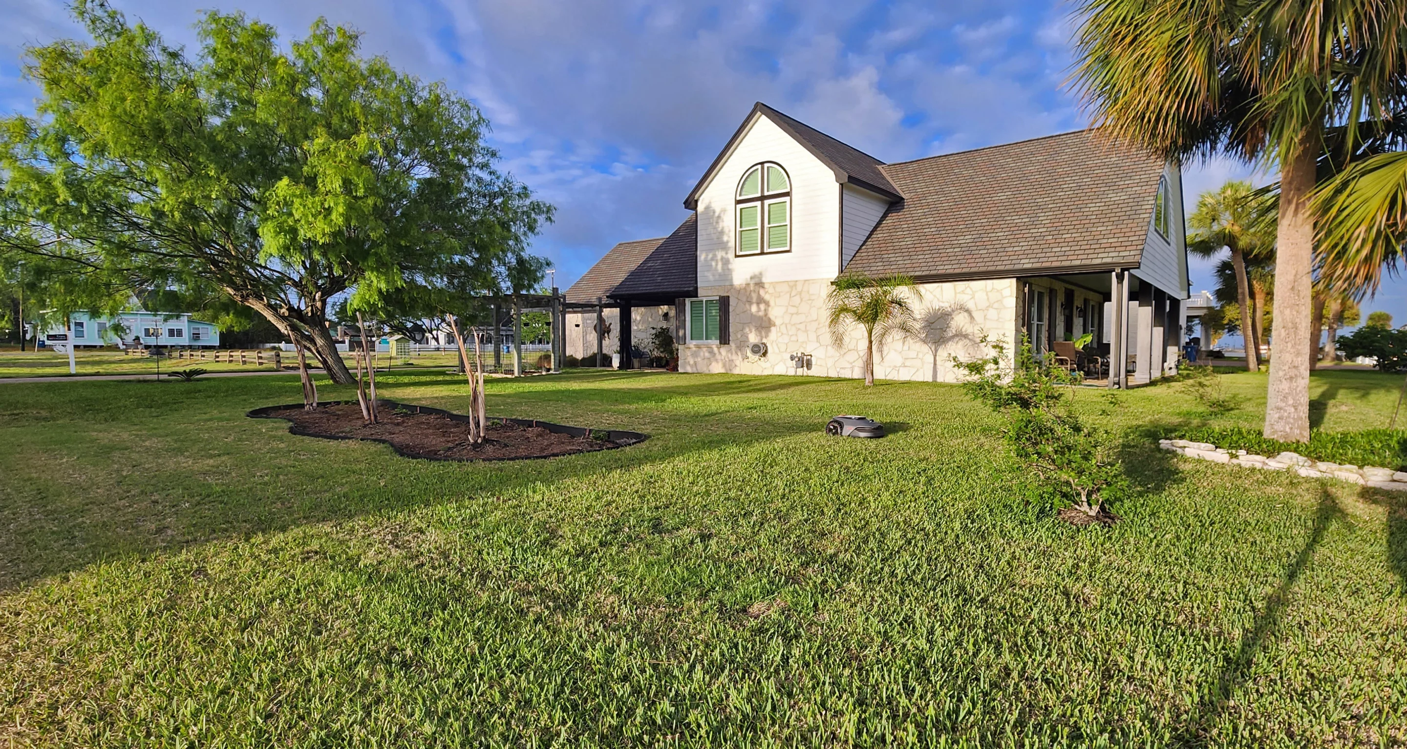 The little mower mows off into the sunset ... it was halfway done by then